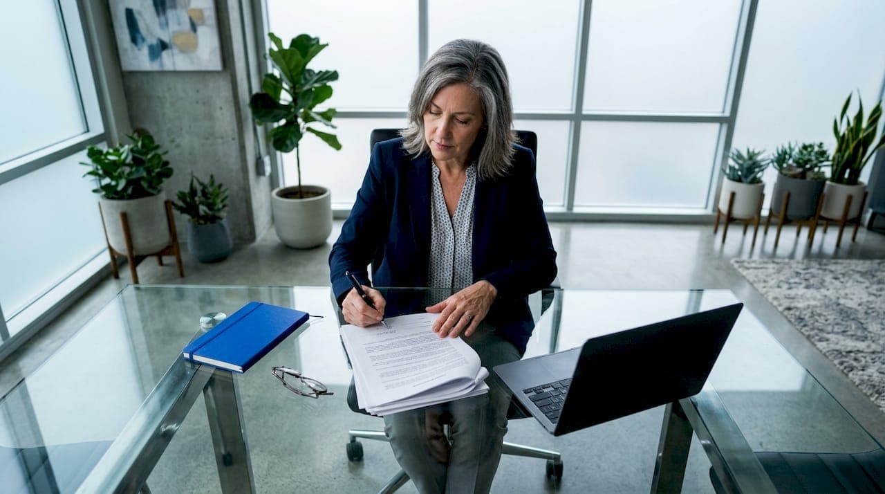 Person reviewing property documents for escrow